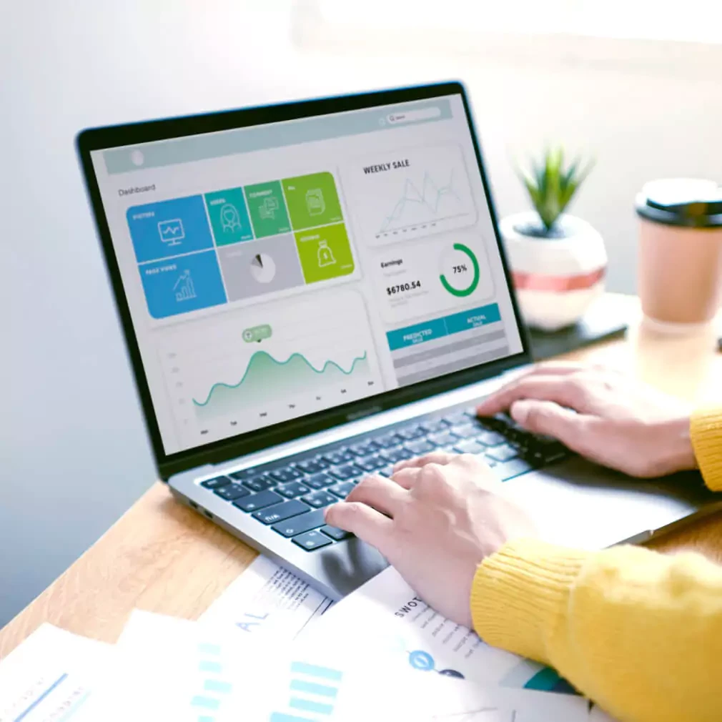 A laptop displaying a marketing dashboard